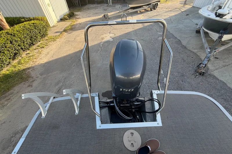 Slide: The Image of 2016 Bennington 22 SX boat with Yamaha 150 outboard motor on a trailer. - 42