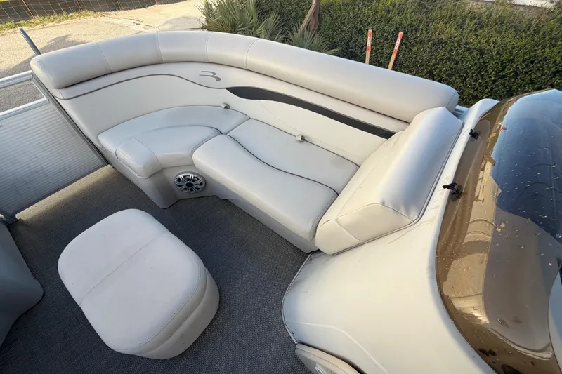 Slide: The Image of 2016 Bennington 22 SX boat interior with plush seating and speaker system. - 59