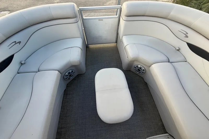 Slide: The Image of 2016 Bennington 22 SX boat interior with plush seating and carpeted flooring. - 61