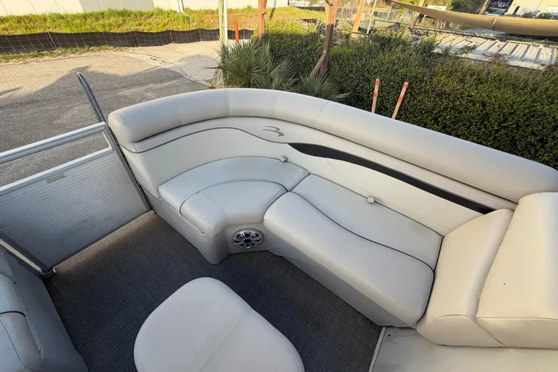 Slide: The Image of 2016 Bennington 22 SX pontoon boat interior with plush seating and speaker system. - 62