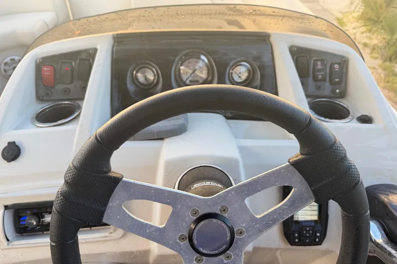 Slide: The Image of Steering wheel and dashboard of a 2016 Bennington 22 SX boat. - 70