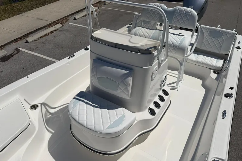 Slide: The Image of 2018 Epic 22SC boat interior with white quilted seating and console. - 20