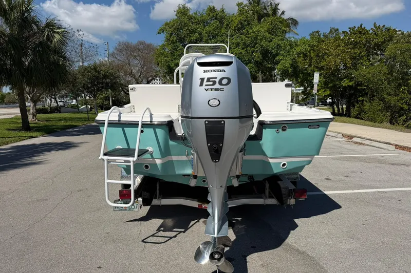 Slide: The Image of 2018 Epic 22SC boat with Honda 150 VTEC engine on trailer. - 4