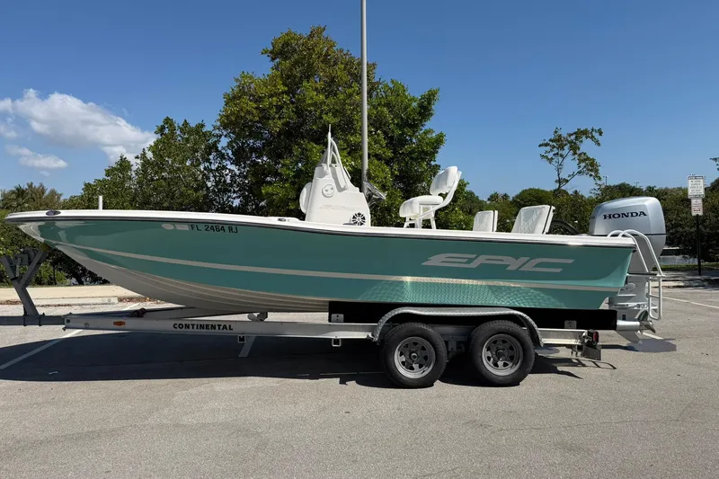 Slide: The Image of 2018 Epic 22SC boat on trailer, parked outdoors with Honda engine. - 6