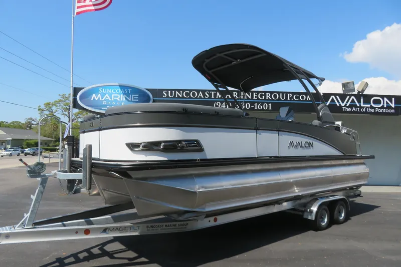 Slide: The Image of 2026 Avalon Catalina Quad Lounge Shift pontoon boat on trailer at Suncoast Marine Group. - 11