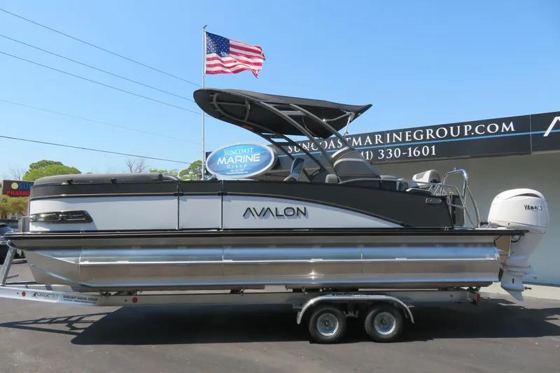 Slide: The Image of 2026 Avalon Catalina Quad Lounge Shift boat on trailer at Suncoast Marine Group. - 12