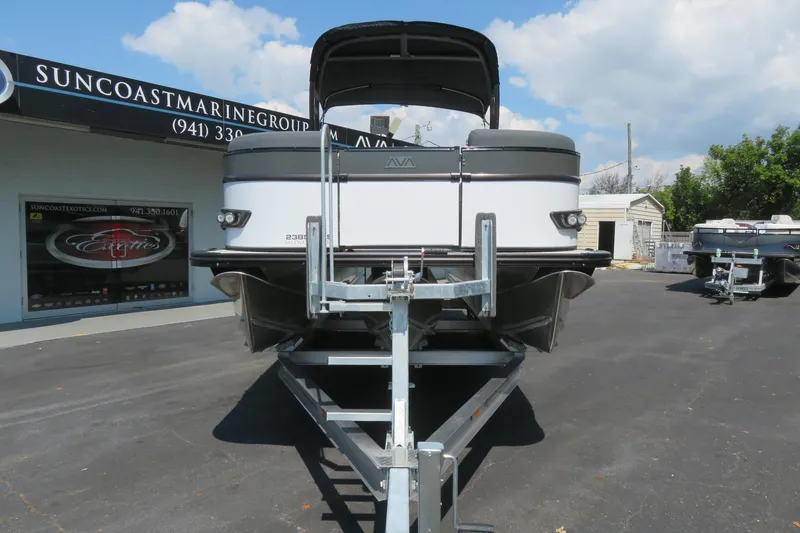 Slide: The Image of 2026 Avalon Catalina Quad Lounge Shift boat on trailer at Suncoast Marine Group. - 18