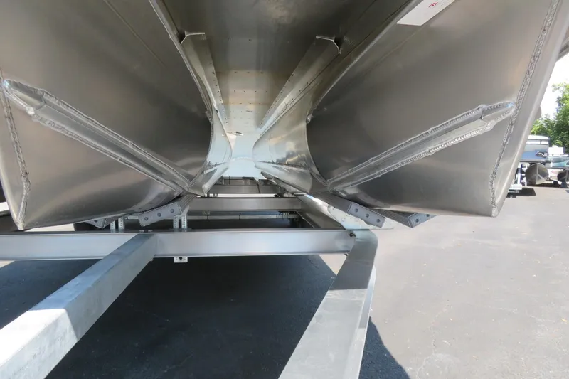 Slide: The Image of Underneath view of 2026 Avalon Catalina Quad Lounge Shift pontoon boat on trailer. - 20