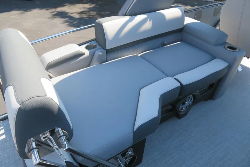 Slide: The Image of Luxurious seating on 2026 Avalon Catalina Quad Lounge Shift boat, featuring sleek gray upholstery. - 30
