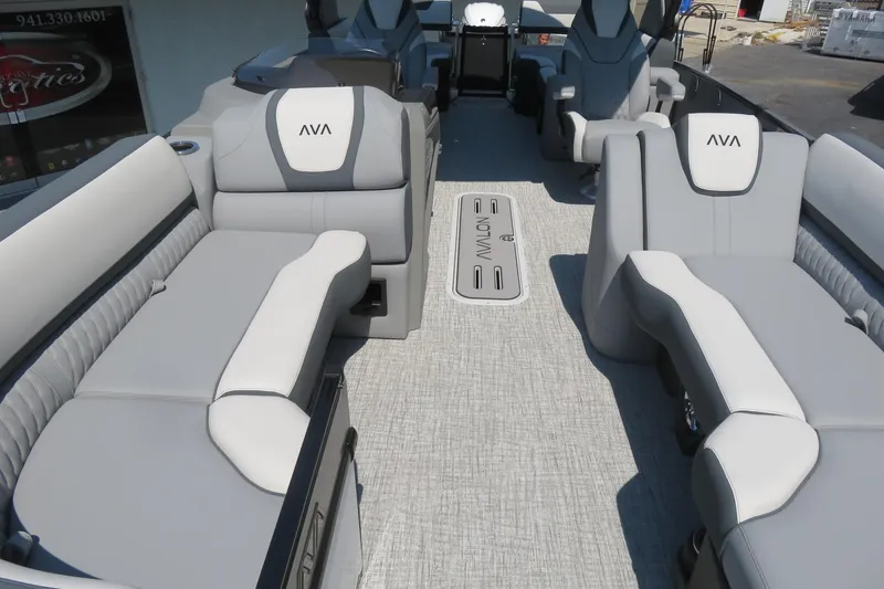 Slide: The Image of 2026 Avalon Catalina Quad Lounge Shift boat interior with gray seating and modern design. - 32