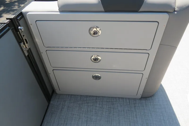 Slide: The Image of 2026 Avalon Catalina Quad Lounge Shift boat storage compartments with sleek design and secure latches. - 43