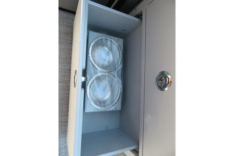 Slide: The Image of Storage compartment with cup holders in 2026 Avalon Catalina Quad Lounge Shift boat. - 45