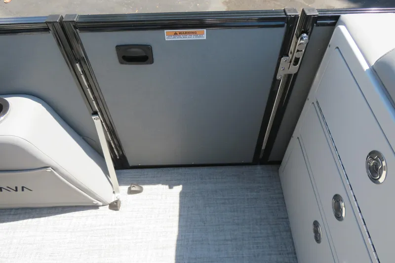 Slide: The Image of 2026 Avalon Catalina Quad Lounge Shift boat interior with seating and storage compartments. - 46