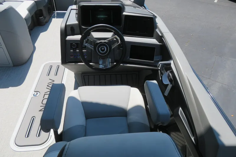 Slide: The Image of 2026 Avalon Catalina Quad Lounge Shift boat cockpit with modern steering and controls. - 53