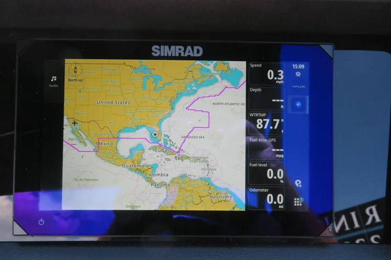 Slide: The Image of Simrad navigation display on Avalon Catalina Quad Lounge Shift, showing map and data. - 58