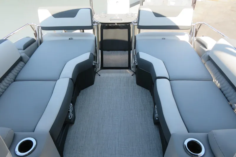 Slide: The Image of 2026 Avalon Catalina Quad Lounge Shift boat interior with luxurious seating and cup holders. - 65