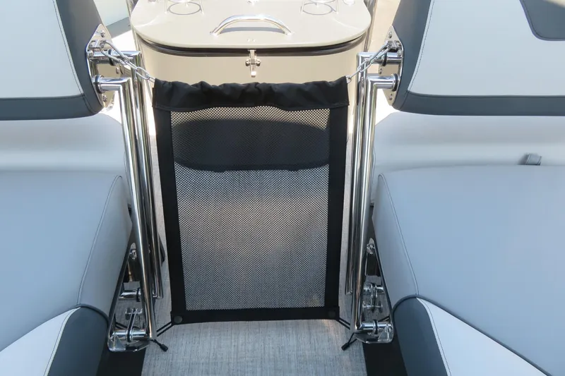Slide: The Image of Interior view of 2026 Avalon Catalina Quad Lounge Shift boat, featuring sleek seating and mesh gate. - 77