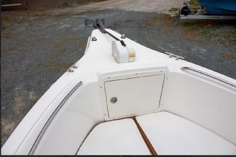 Slide: The Image of 2001 Cobia 274 Center Console boat bow with anchor and storage compartment. - 16