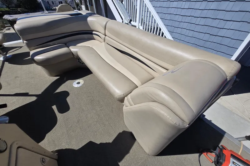 Slide: The Image of Beige seating on 2013 Bennington 2574 GL boat, showcasing spacious and comfortable design. - 15