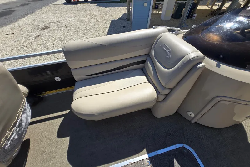 Slide: The Image of 2013 Bennington 2574 GL boat interior with beige seating and sleek design. - 18