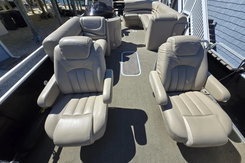 Slide: The Image of Interior of 2013 Bennington 2574 GL pontoon boat with beige leather seating. - 20