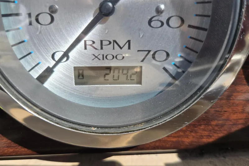 Slide: The Image of Close-up of a Bennington 2574 GL 2013 RPM gauge displaying 204.2. - 26
