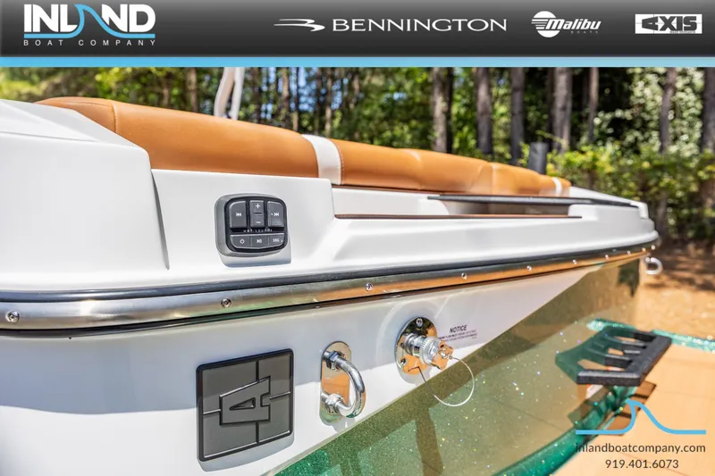 Slide: The Image of Axis T220 boat 2026 with brown seats and controls. - 11