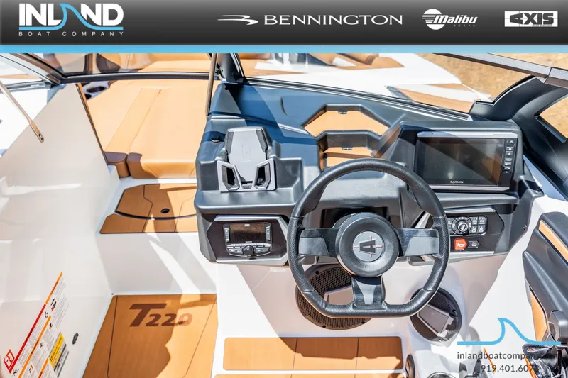Slide: The Image of Interior view of Axis T220 boat, 2026 model, featuring modern helm console. - 15