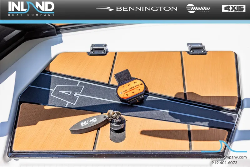Slide: The Image of Axis T220 boat deck with remote control and keychain, 2026 model. - 16