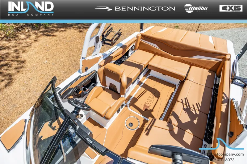 Slide: The Image of Interior view of Axis T220 boat, 2026 model, featuring beige leather seating. - 23