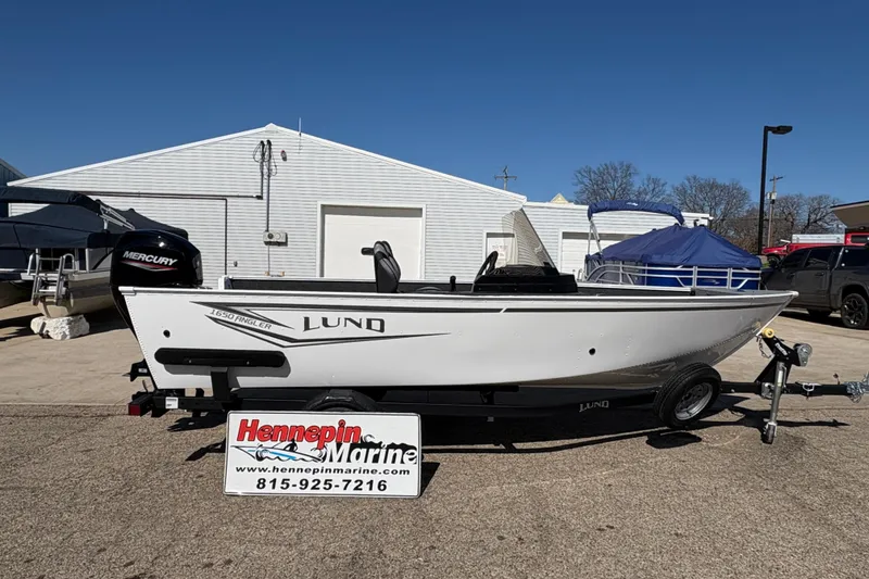 The Image of 2026 Lund 1650 Angler SS boat on trailer at Hennepin Marine dealership. - 0