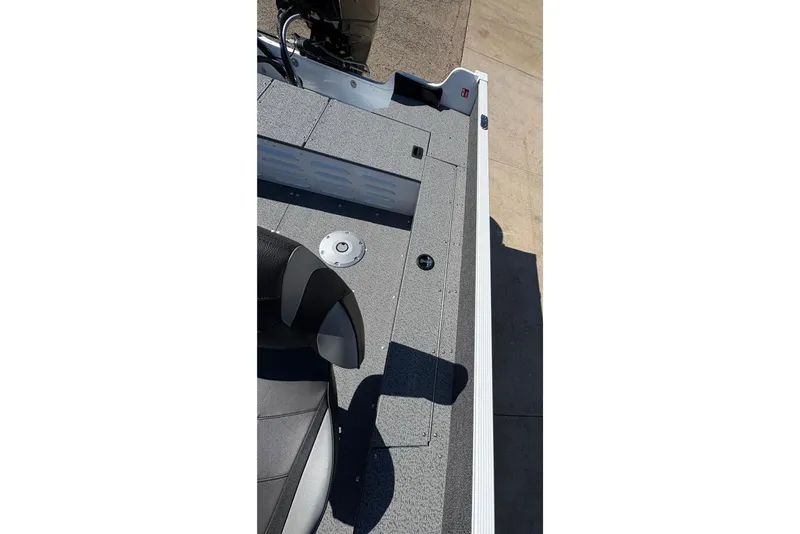 Slide: The Image of 2026 Lund 1650 Angler SS boat interior with seating and deck details. - 19