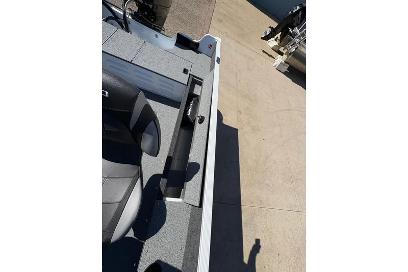 Slide: The Image of 2026 Lund 1650 Angler SS boat interior with seating and storage compartments. - 20