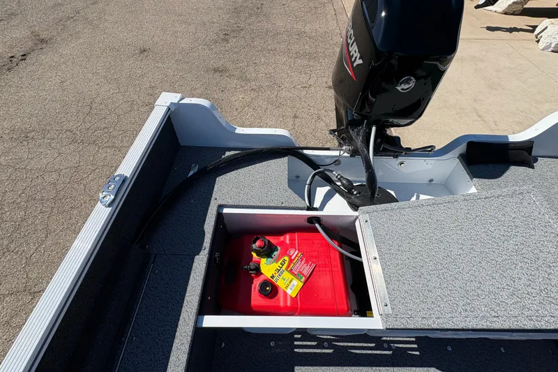 Slide: The Image of 2026 Lund 1650 Angler SS boat with Mercury outboard motor and red fuel tank. - 22