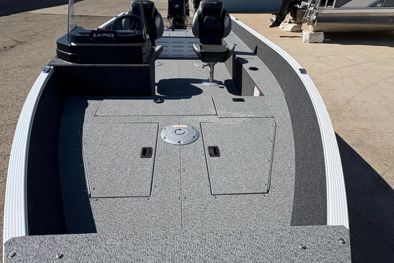 Slide: The Image of 2026 Lund 1650 Angler SS fishing boat with spacious deck and seating. - 7