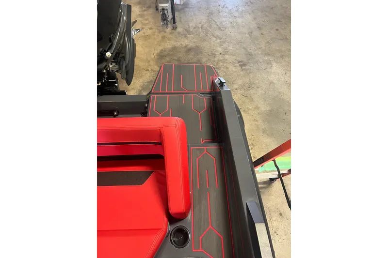 Slide: The Image of Interior of 2026 Iron 907 boat with red seating and modern design. - 11