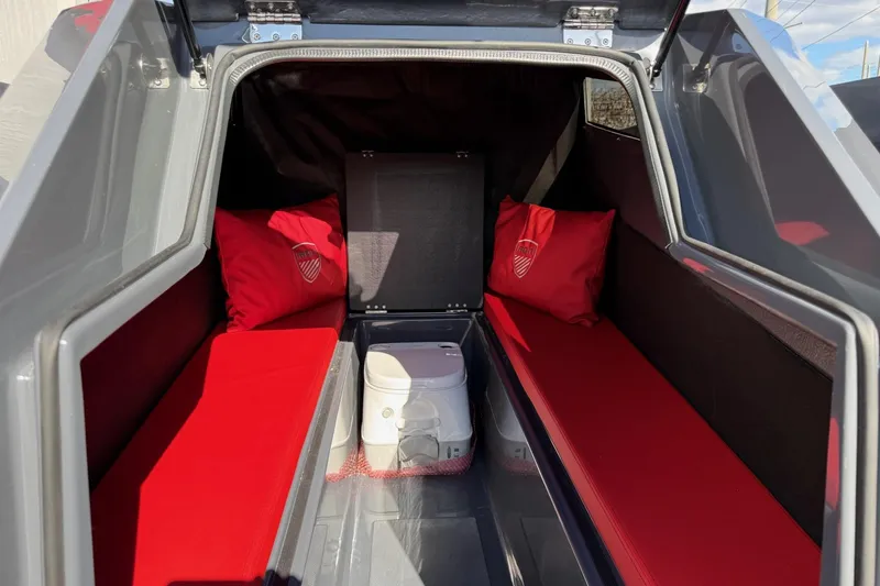 Slide: The Image of Interior of Iron 907 model 2026 with red cushions and portable toilet. - 14