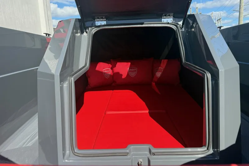 Slide: The Image of Open truck bed with red interior cushions, Iron 907 model, 2026. - 21