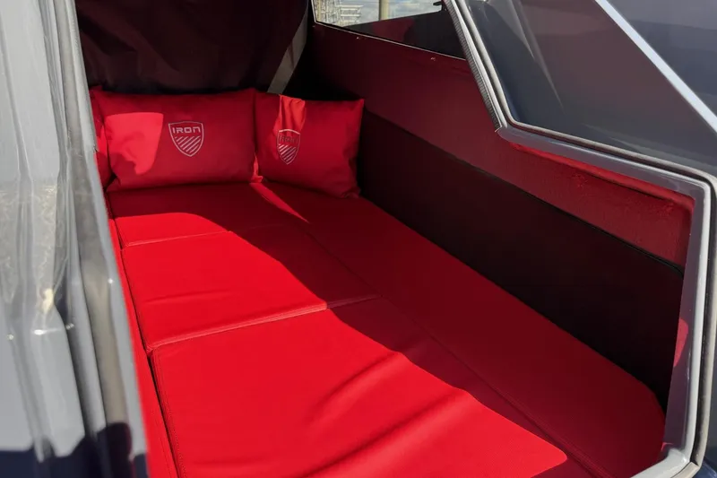 Slide: The Image of Red interior seating of 2026 Iron 907 model with branded cushions. - 24