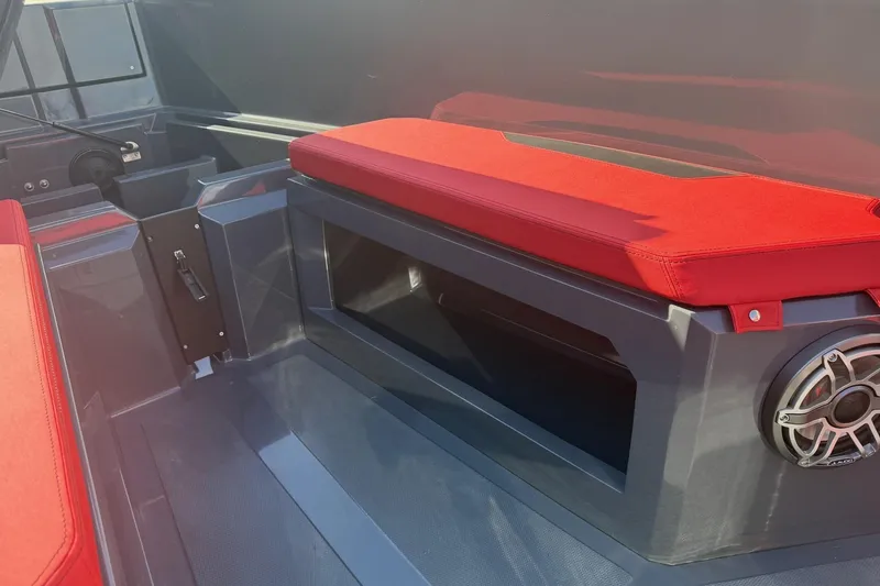 Slide: The Image of Interior of 2026 Iron 907 boat with red seating and speaker system. - 29