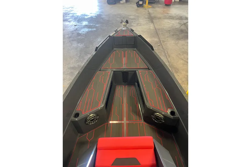 Slide: The Image of Red interior of 2026 Iron 907 boat with modern seating and controls. - 6