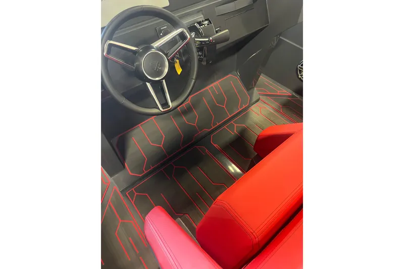 Slide: The Image of Interior of 2026 Iron 907 boat with red seating and modern design. - 9