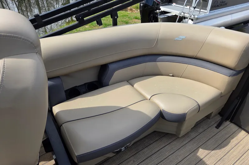 Slide: The Image of 2024 Starcraft EXS 1 boat interior with beige and gray cushioned seating. - 11