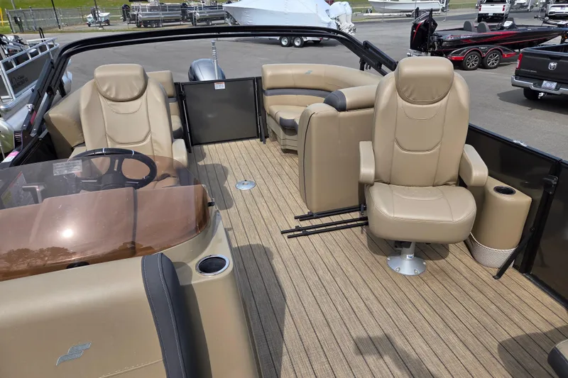 Slide: The Image of 2024 Starcraft EXS 1 boat interior with beige seating and wood-style flooring. - 16