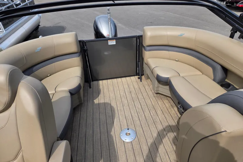 Slide: The Image of 2024 Starcraft EXS 1 boat interior with beige seating and spacious layout. - 9