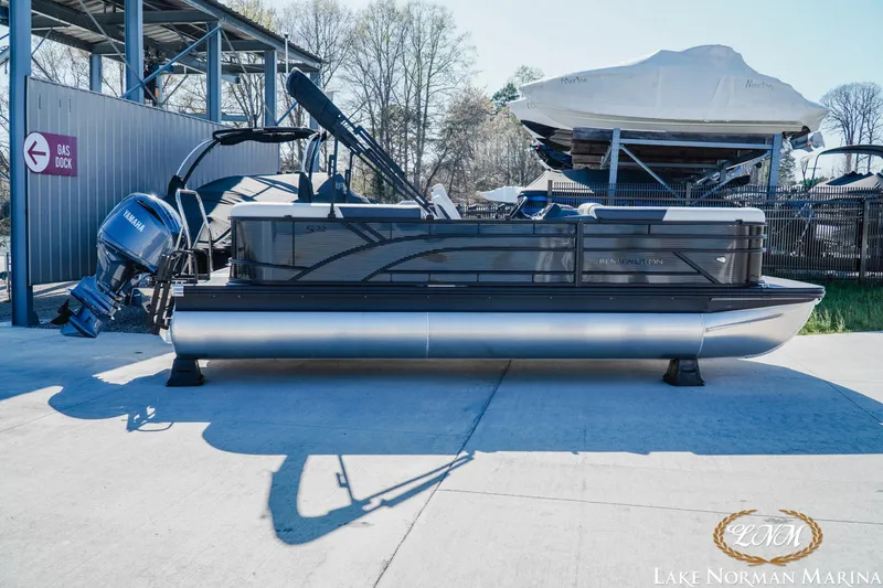 The Image of 2026 Bennington 22SSR pontoon boat at Lake Norman Marina, featuring Yamaha outboard motor. - 1