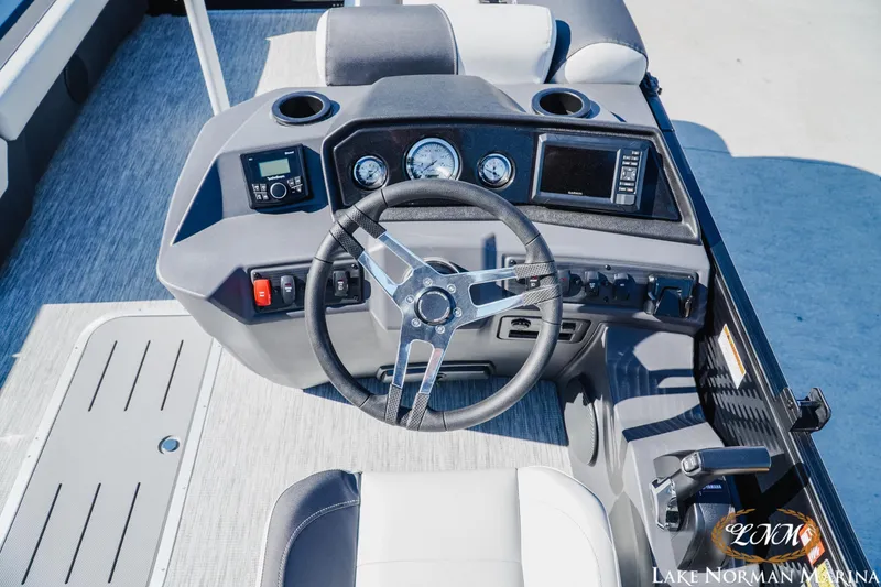 Slide: The Image of 2026 Bennington 22SSR boat dashboard with steering wheel and control panel. - 10