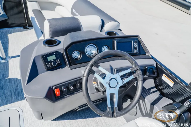 Slide: The Image of Steering console of 2026 Bennington 22SSR boat with modern controls and gauges. - 11