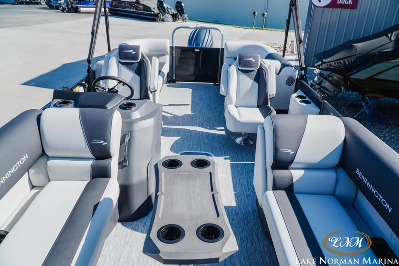 Slide: The Image of 2026 Bennington 22SSR pontoon boat interior with plush seating and cup holders. - 14