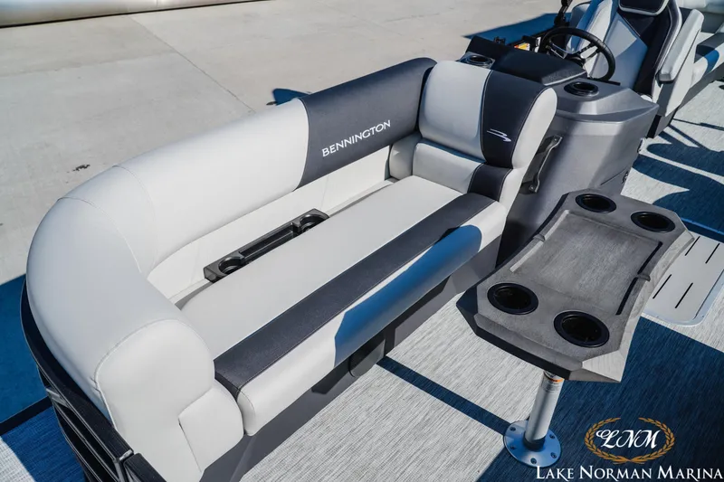 Slide: The Image of 2026 Bennington 22SSR pontoon boat interior with plush seating and cup holders. - 15